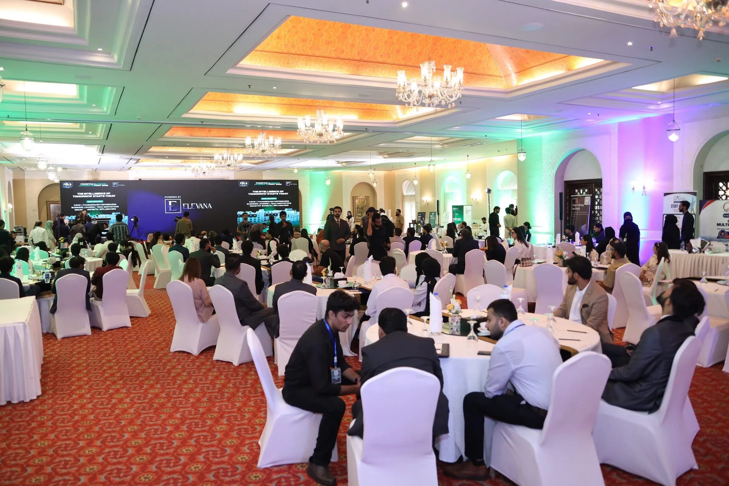 Delegates seated across the ballroom facing the stage screens at PBLS Serena Islamabad